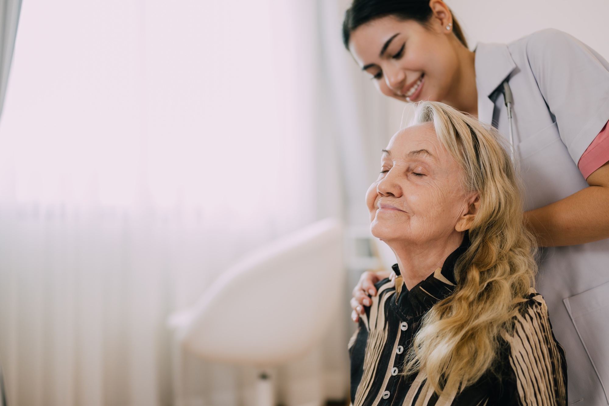 Senior patient with home care nurse, Happy senior woman talking with caregiver