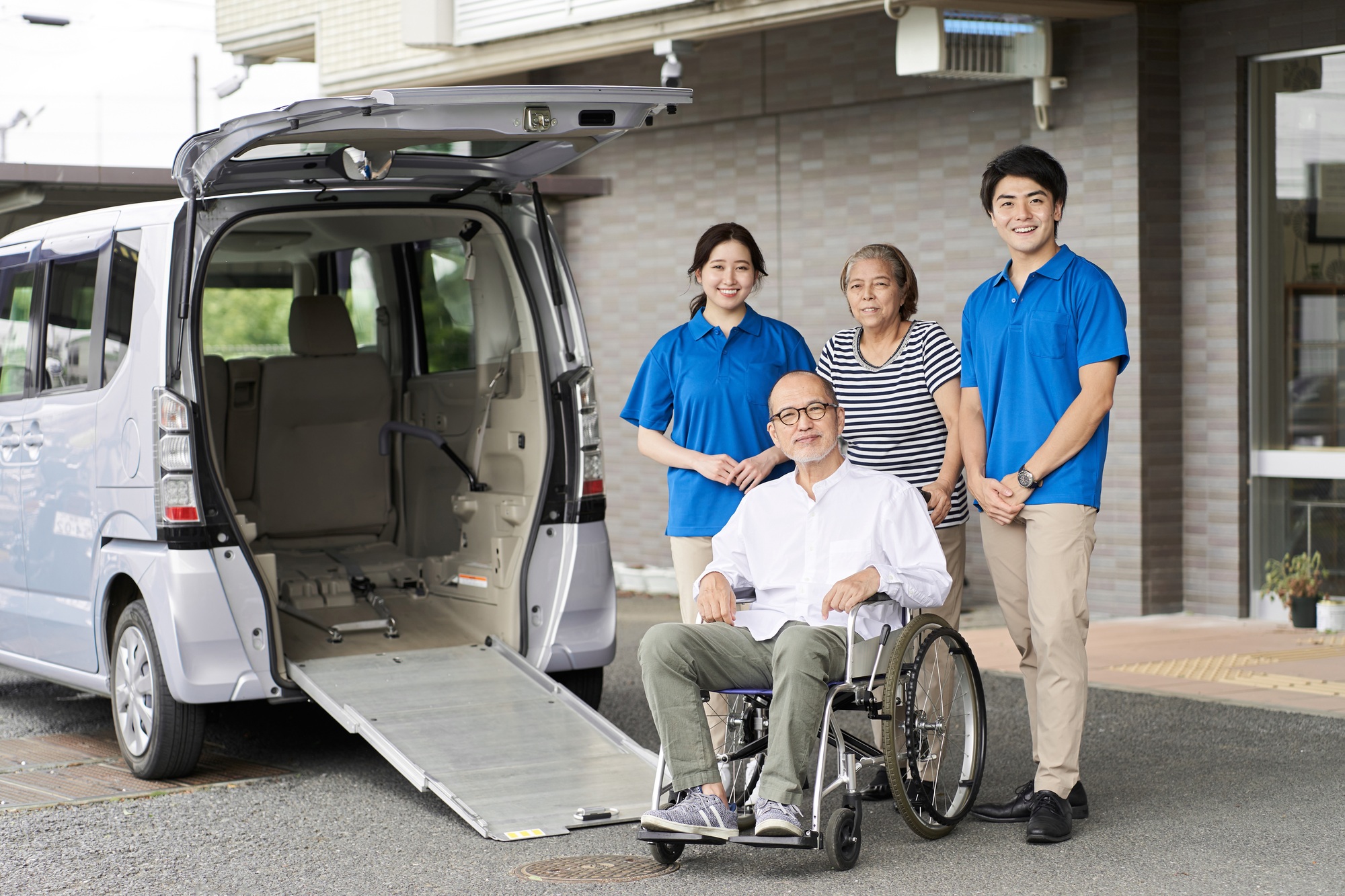 Wheelchair riding elderly and caregivers